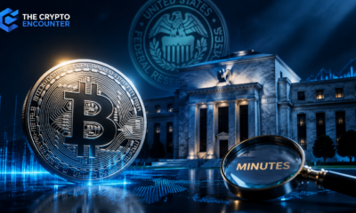 Cinematic image showing a metallic Bitcoin beside a Federal Reserve-style building and a magnifying glass labeled “Minutes,” with The Crypto Encounter logo in the corner.